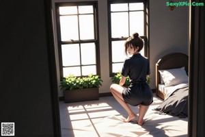 A woman sitting on the floor in front of a window.